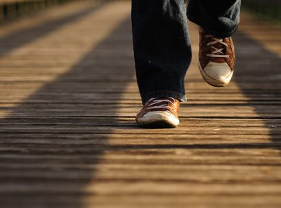 person jogging at risk of common causes of falls